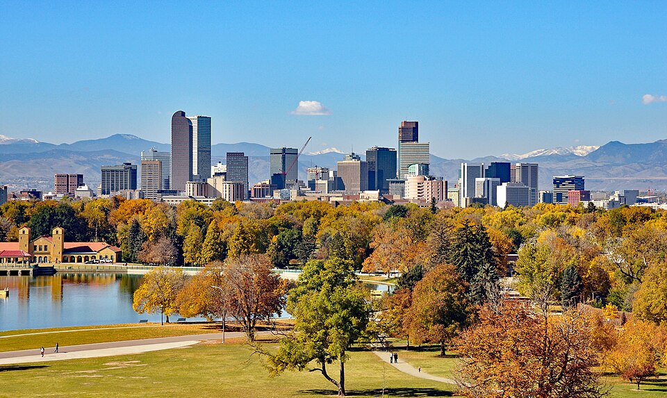 Denver skyline with Rocky Mountains at sunset