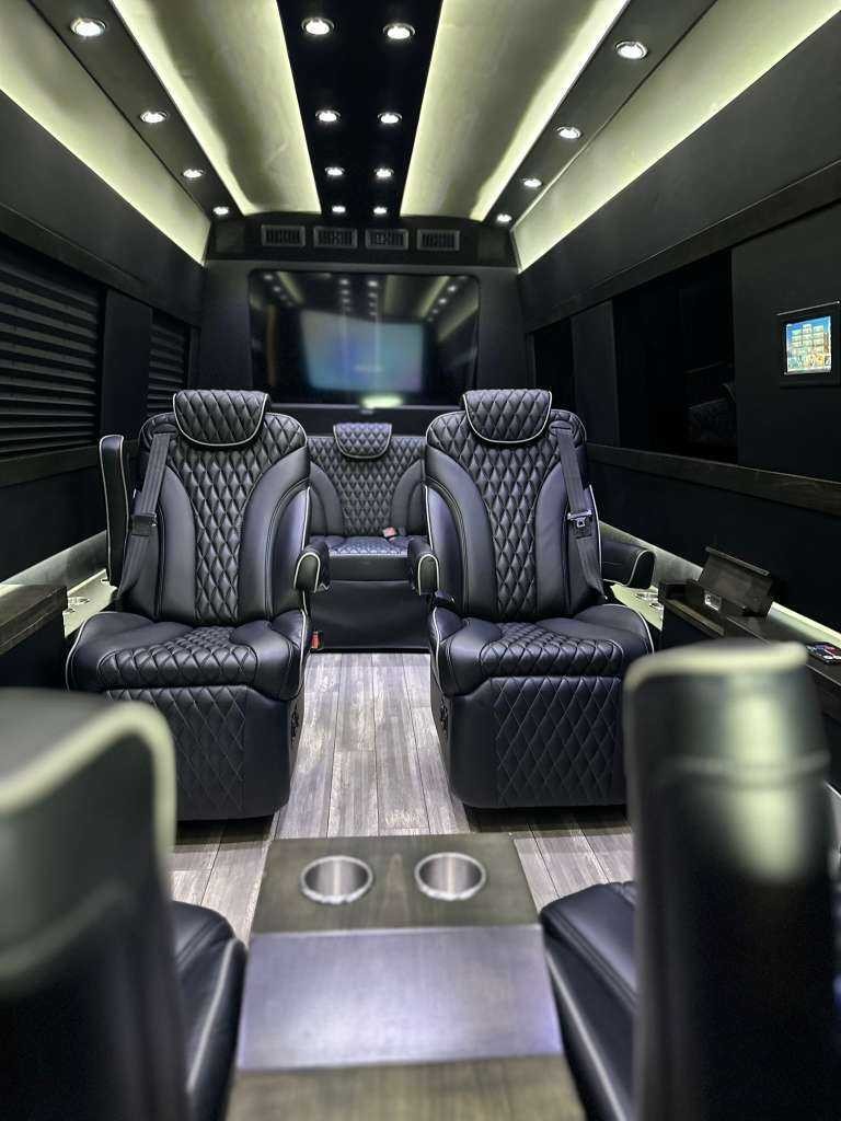 Arion Jet Sprinter interior — diamond-stitched leather captain chairs with ambient lighting